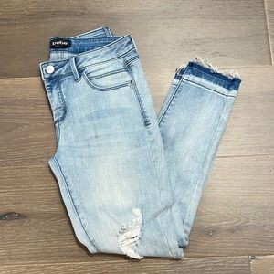 Bebe skinny jeans with faded fray bottoms. Super soft and stretchy 27